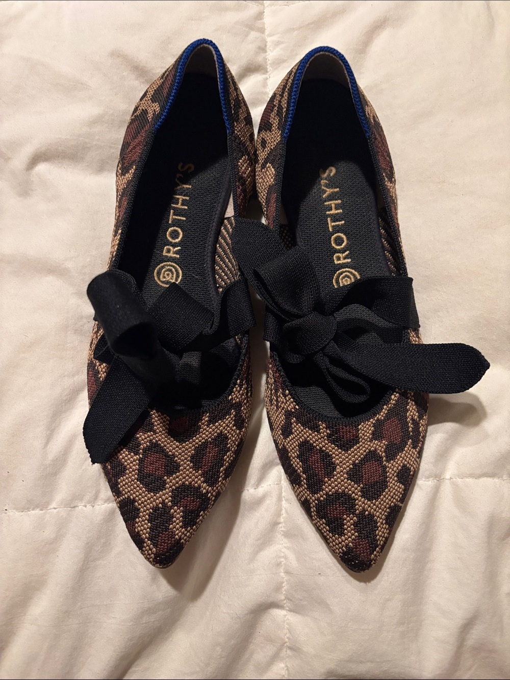Rothy's Leopard Print Pointed Flats with Black Bow Accent